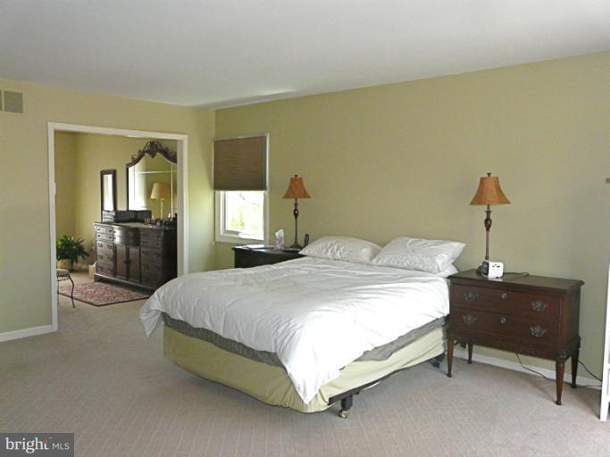 16 Manor Brook Road Monkton, MD 21111 - Photo 3 of 30 a spacious bedroom with a bed and a dresser