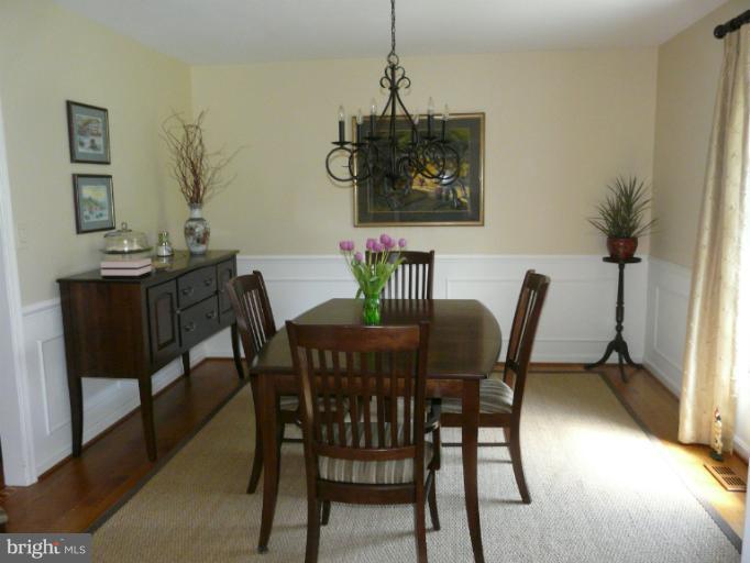 16 Manor Brook Road Monkton, MD 21111 - Photo 26 of 30 a view of a dining room with furniture and wooden floor