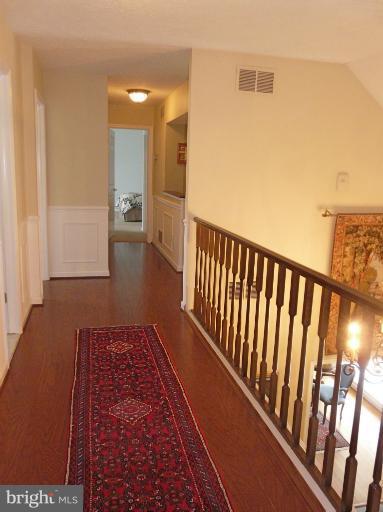 16 Manor Brook Road Monkton, MD 21111 - Photo 27 of 30 a view of a hallway with wooden floor and a bathroom