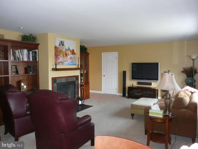 16 Manor Brook Road Monkton, MD 21111 - Photo 4 of 30 a living room with furniture a flat screen tv and a fireplace