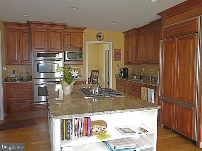 16 Manor Brook Road Monkton, MD 21111 - Photo 5 of 30 a kitchen with stainless steel appliances granite countertop a refrigerator and a stove top oven