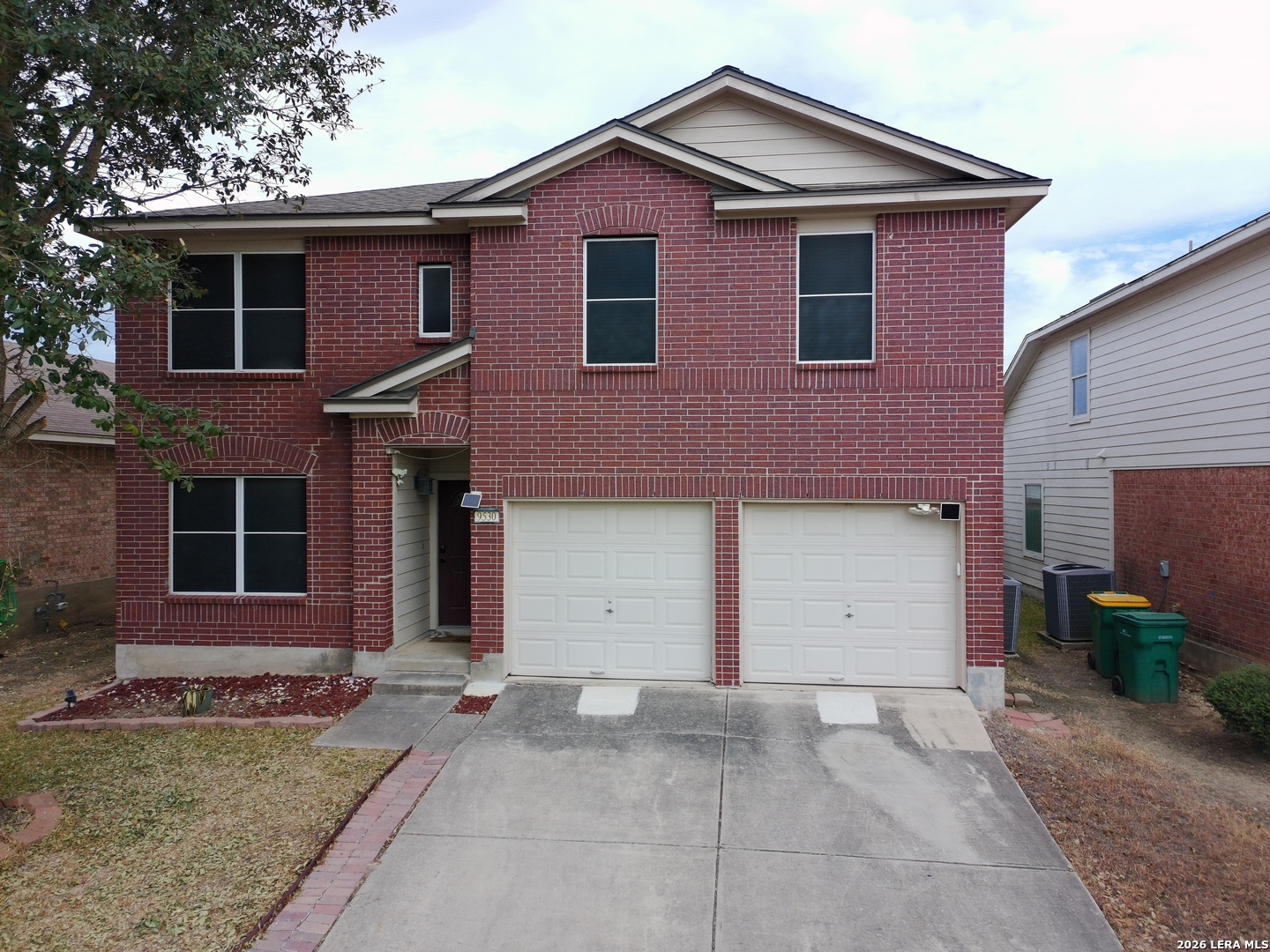 9530 Ascending Converse, TX 78109 - Photo 1 of 15 a front view of a house with a yard and garage