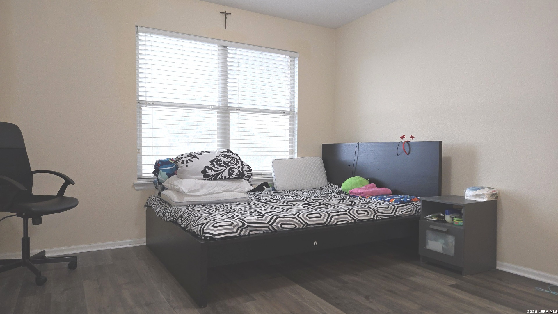 9530 Ascending Converse, TX 78109 - Photo 13 of 15 a bedroom with a bed and wooden floor