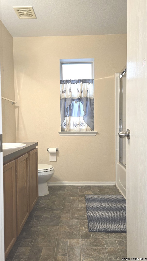 9530 Ascending Converse, TX 78109 - Photo 14 of 15 a bathroom with a toilet a sink and a mirror