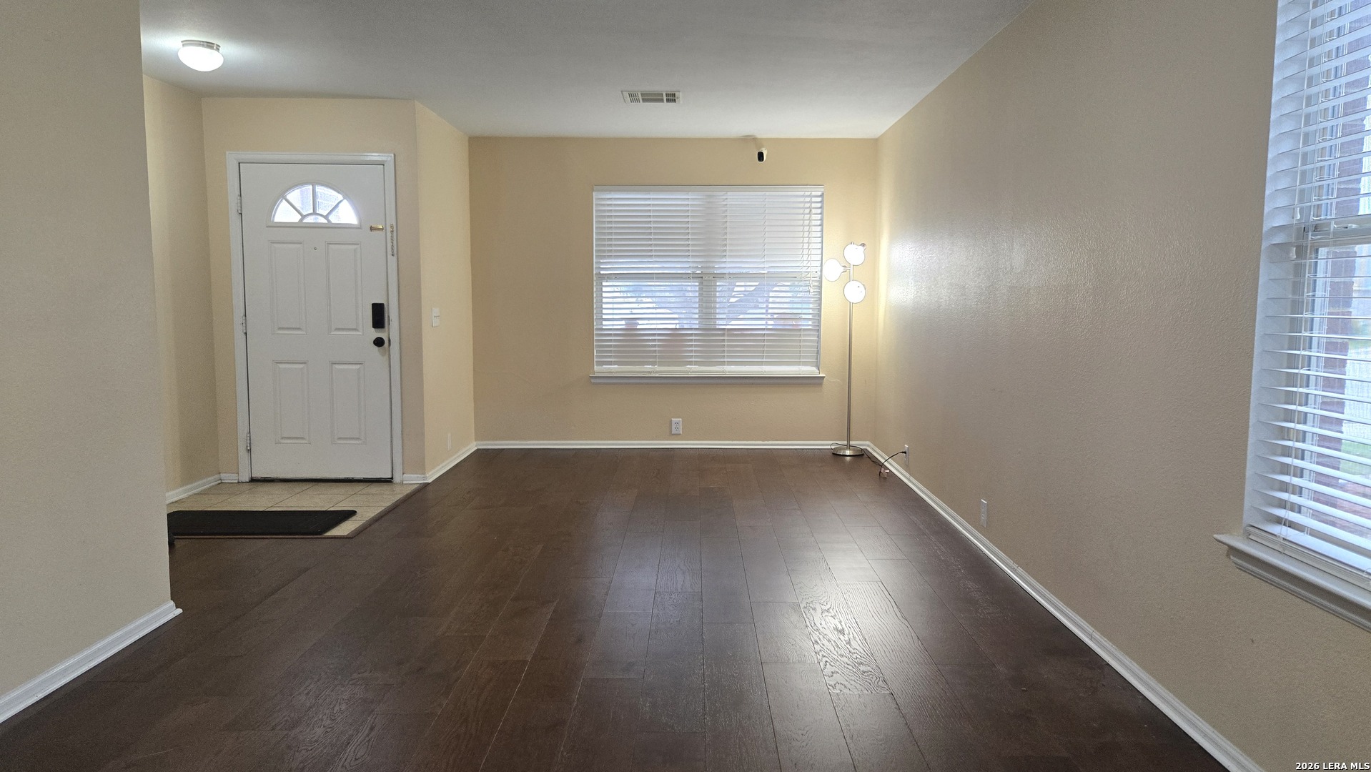 9530 Ascending Converse, TX 78109 - Photo 2 of 15 an empty room with wooden floor and windows