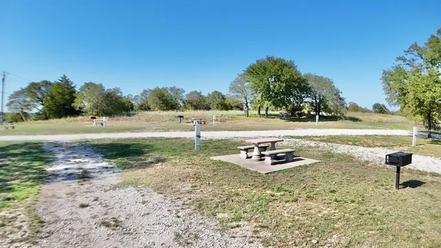 an aerial view of a houses with a yard