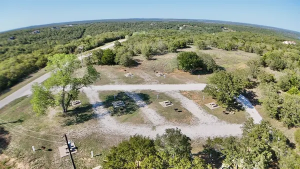 a view of a house with sitting area and yard