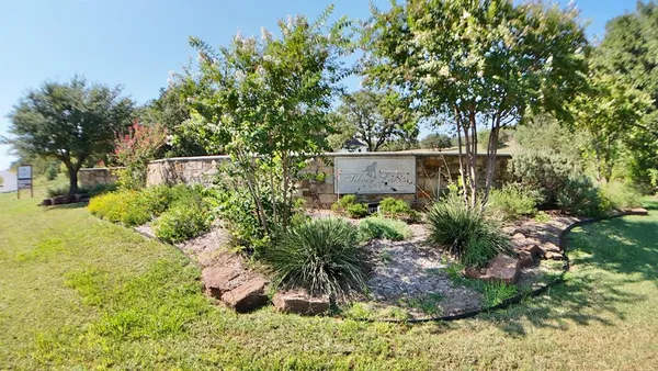 a front view of a house with a yard and outdoor seating