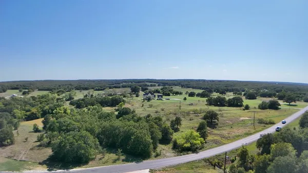 an aerial view of mountain with trees