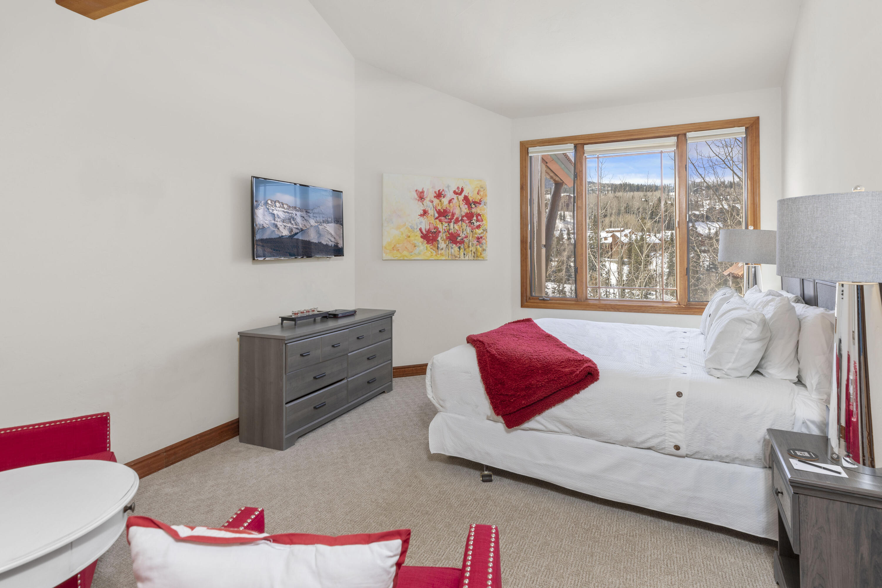 120 Vischer Drive, Unit 135 Mountain Village, CO 81435 - Photo 14 of 35 a bedroom with furniture and a large window