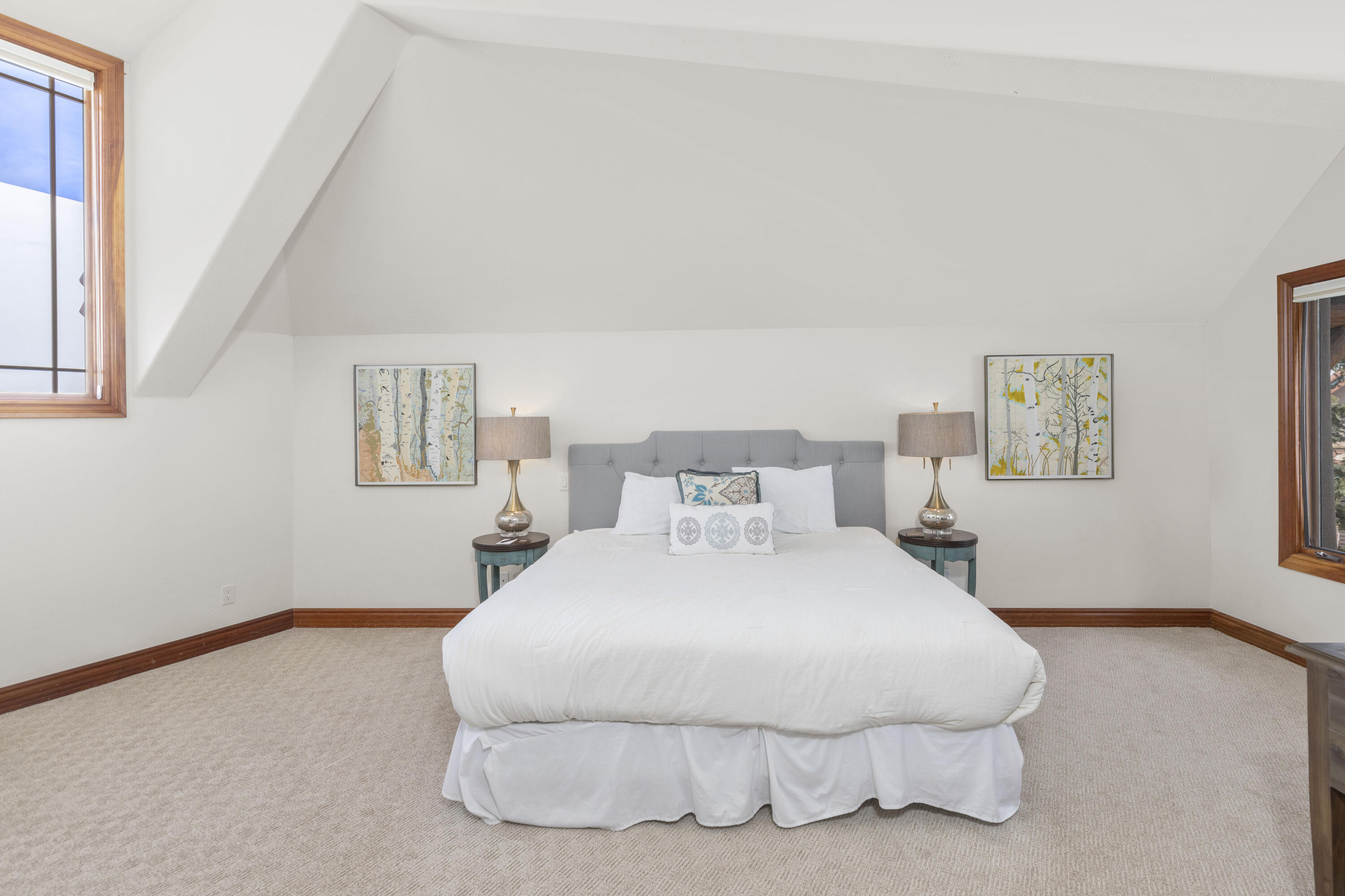 120 Vischer Drive, Unit 135 Mountain Village, CO 81435 - Photo 18 of 35 a bedroom with a bed and painting on the wall