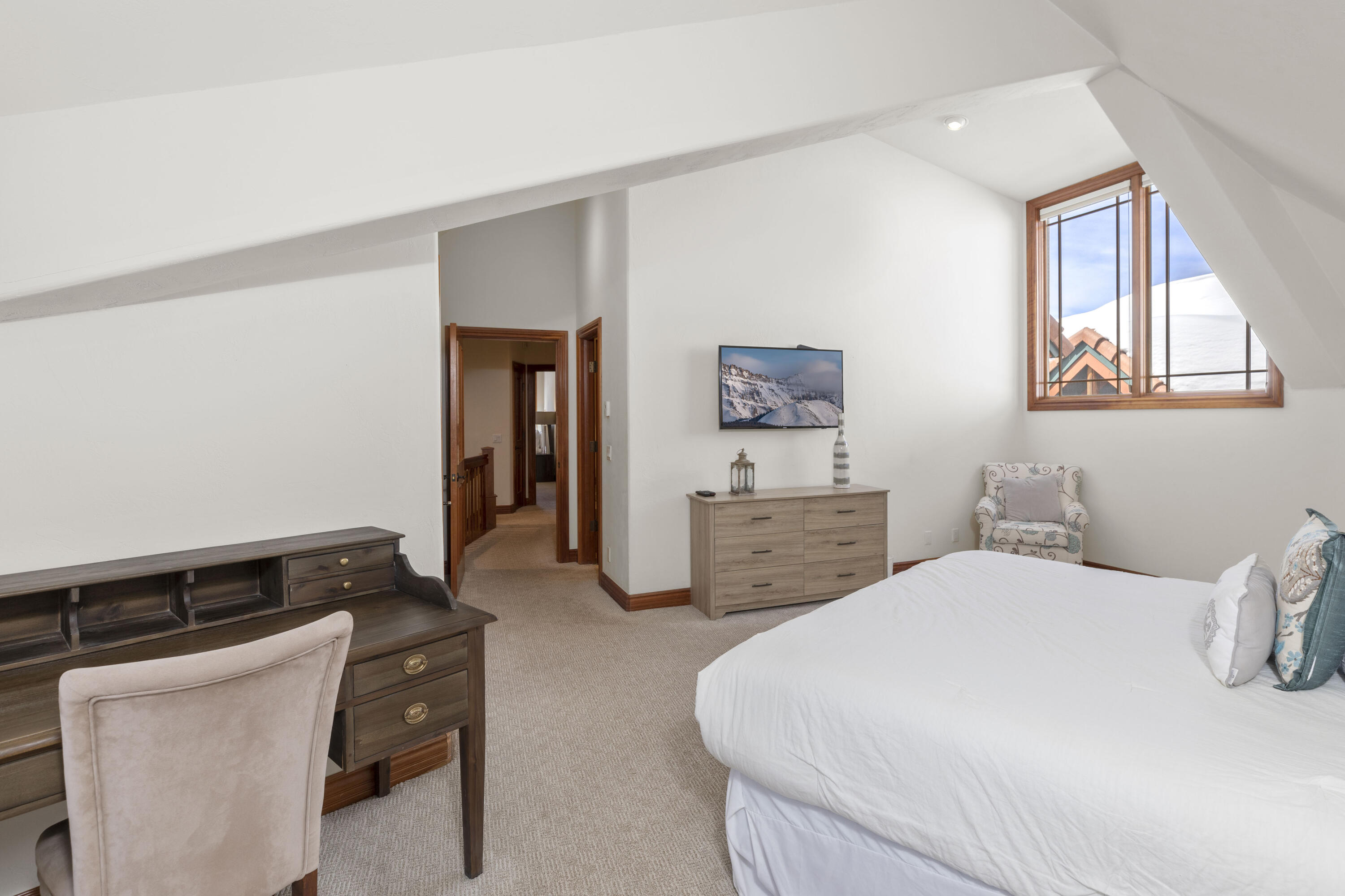 120 Vischer Drive, Unit 135 Mountain Village, CO 81435 - Photo 20 of 35 a bedroom with bed and window