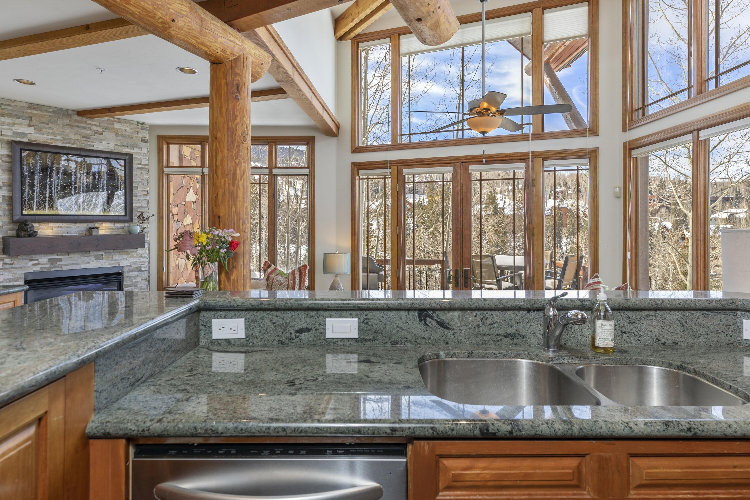 120 Vischer Drive, Unit 135 Mountain Village, CO 81435 - Photo 2 of 35 a kitchen with a sink and a large window