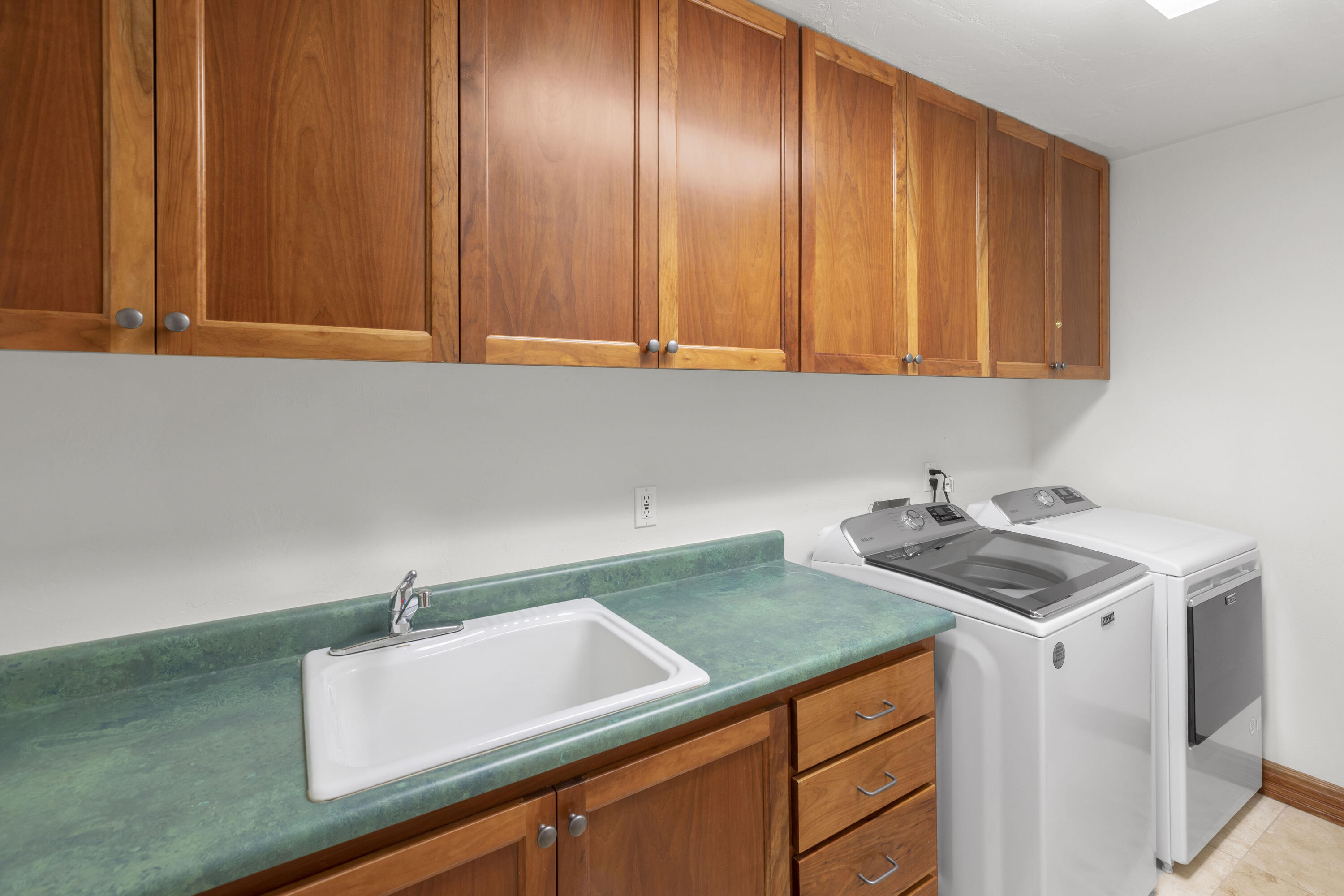 120 Vischer Drive, Unit 135 Mountain Village, CO 81435 - Photo 22 of 35 a kitchen with a sink cabinets and a sink