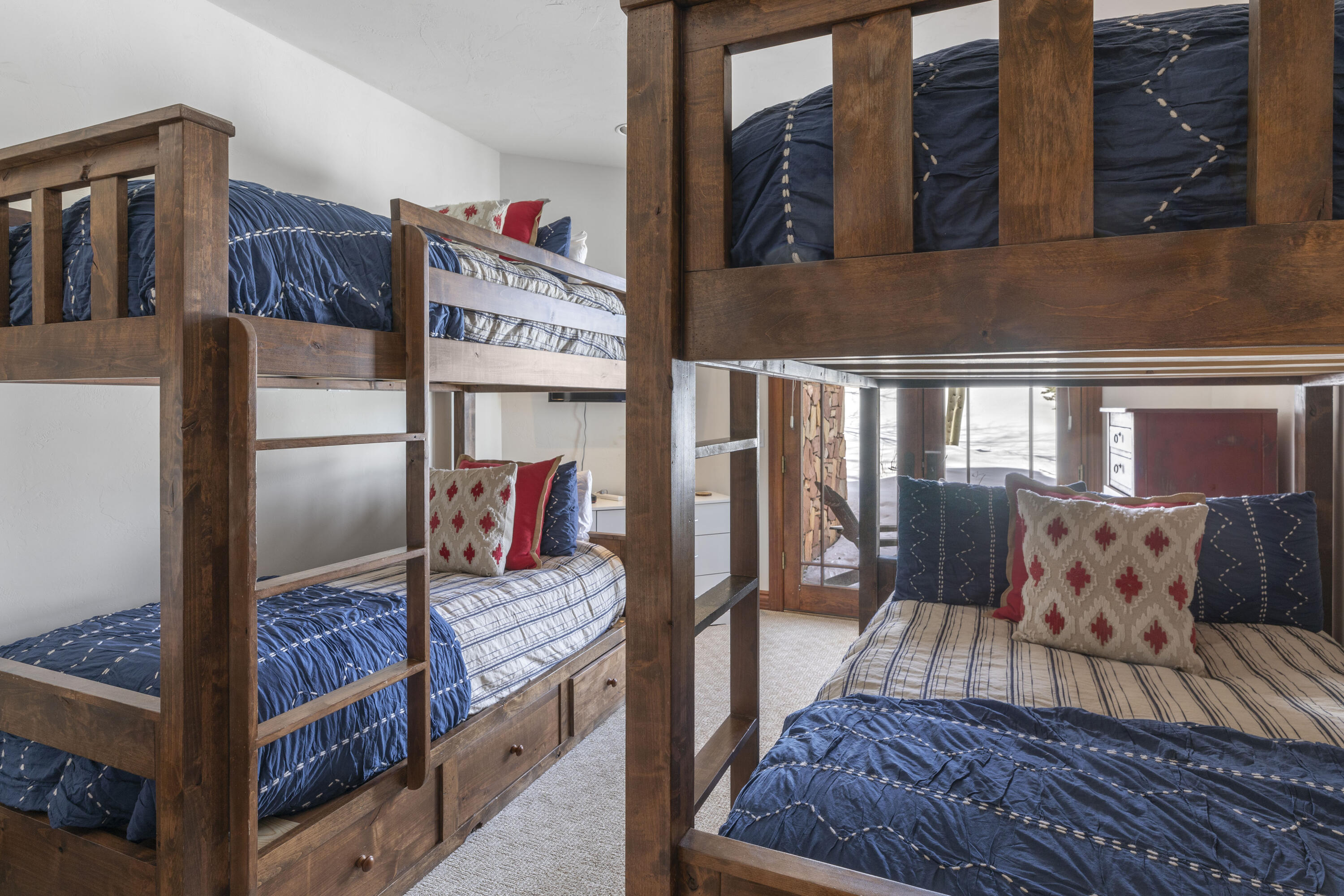 120 Vischer Drive, Unit 135 Mountain Village, CO 81435 - Photo 23 of 35 a bed room with a bed and a couch