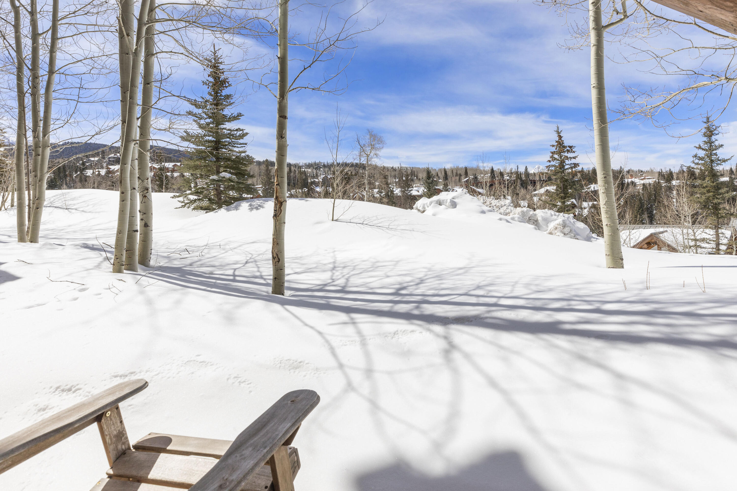 120 Vischer Drive, Unit 135 Mountain Village, CO 81435 - Photo 28 of 35 a view of a terrace with a bench