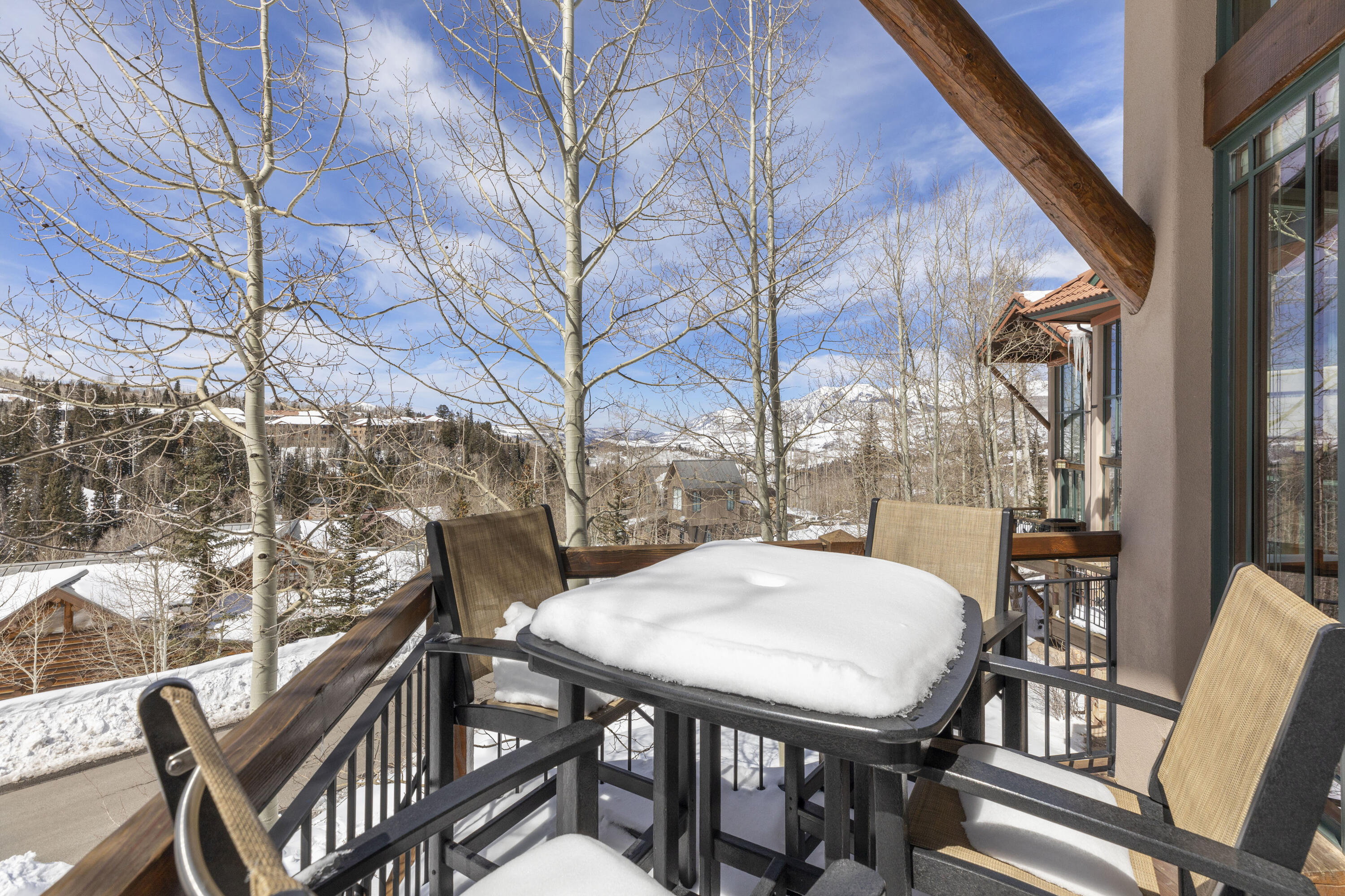 120 Vischer Drive, Unit 135 Mountain Village, CO 81435 - Photo 30 of 35 a view of a patio with a table chairs and couches