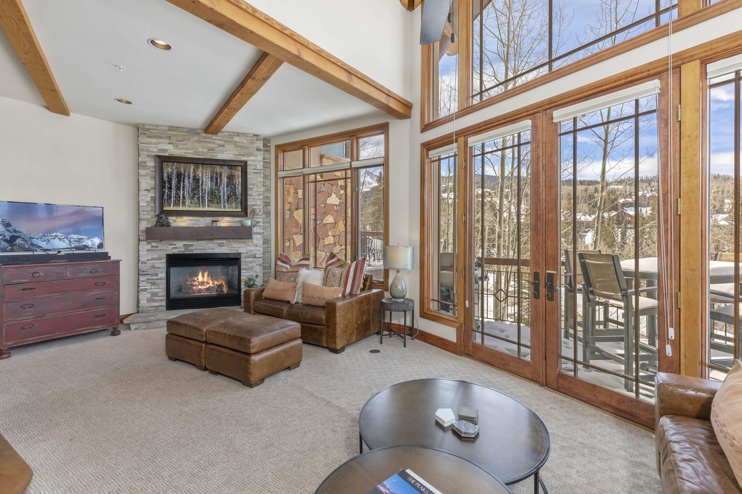 120 Vischer Drive, Unit 135 Mountain Village, CO 81435 - Photo 5 of 35 a living room with furniture and a fireplace