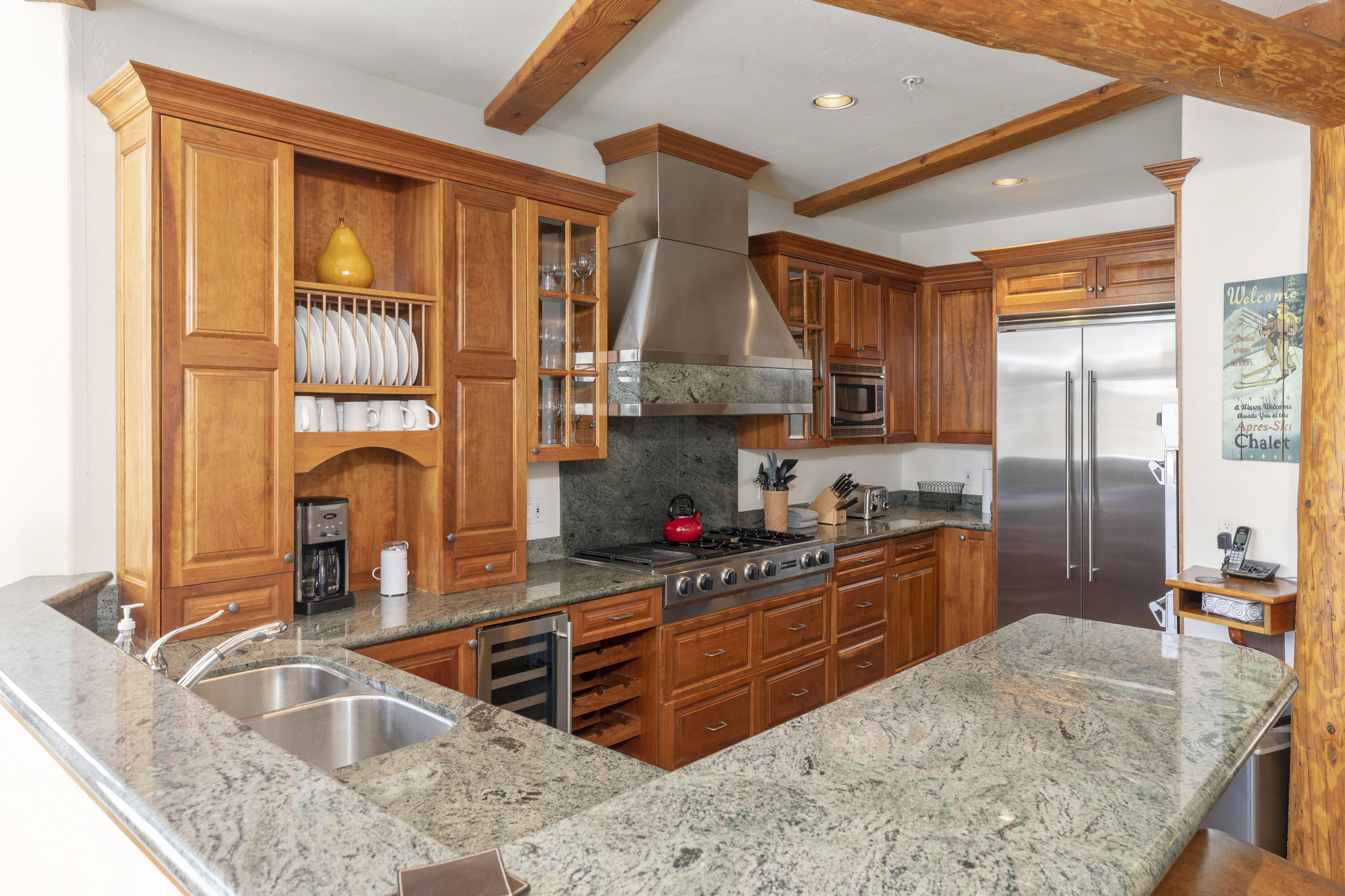 120 Vischer Drive, Unit 135 Mountain Village, CO 81435 - Photo 8 of 35 a kitchen with stainless steel appliances granite countertop a sink stove and refrigerator