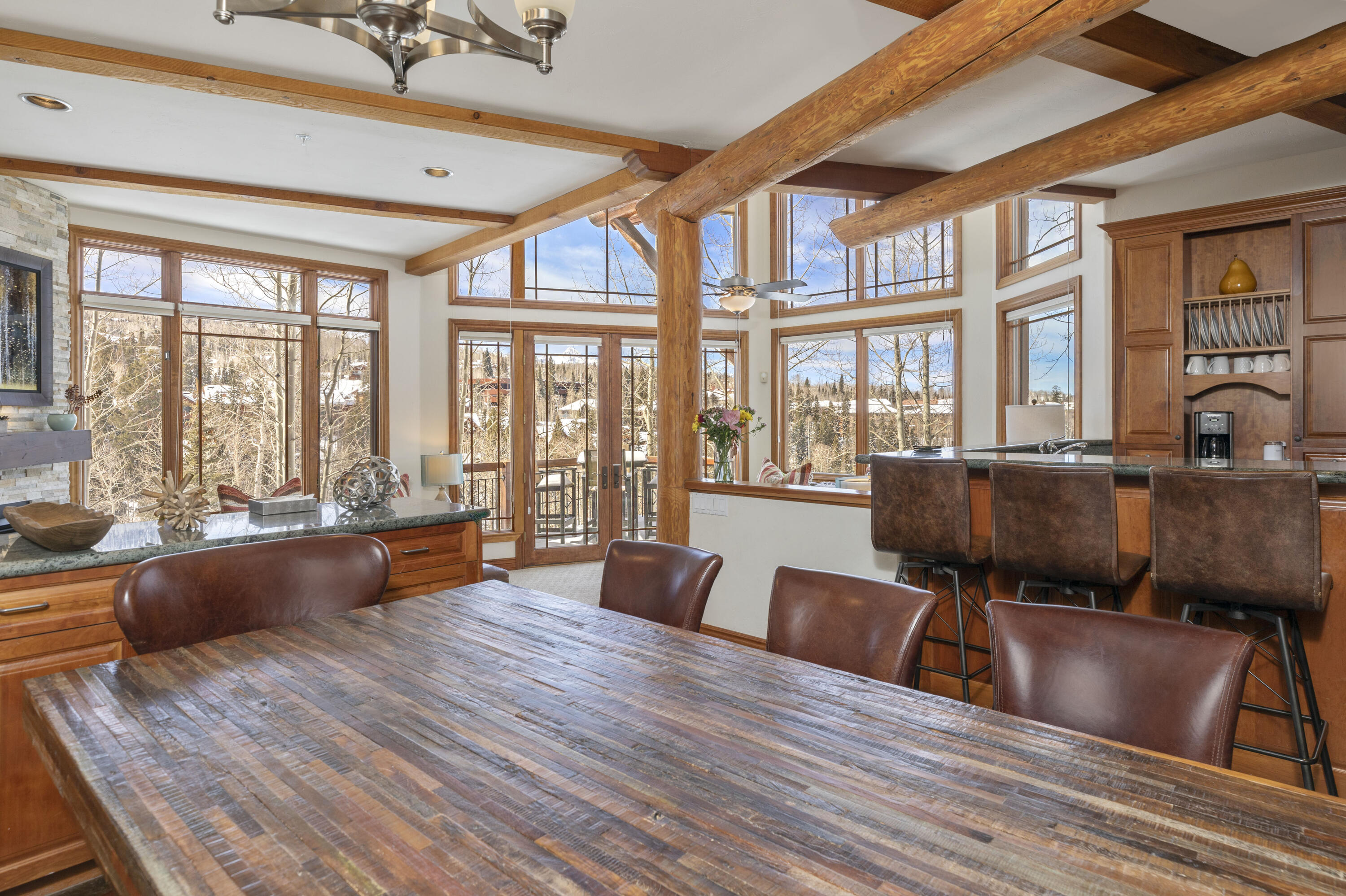 120 Vischer Drive, Unit 135 Mountain Village, CO 81435 - Photo 10 of 35 a living room filled with furniture window and wooden floor