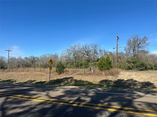 a view of a road with an ocean view