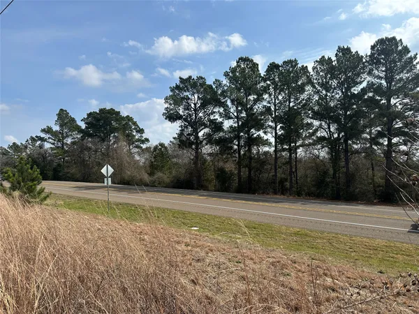 a view of a swimming pool with an outdoor space and seating area