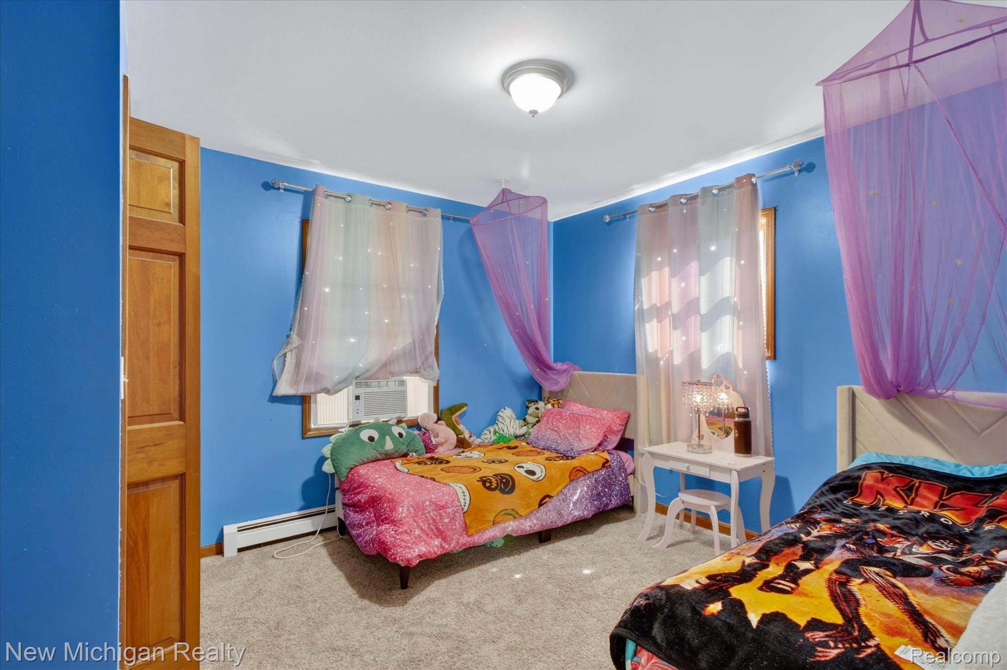 22623 11 Mile Road Reed City, MI 49677 - Photo 24 of 47 Bedroom featuring neutral carpet flooring and a window with an integrated air conditioning unit