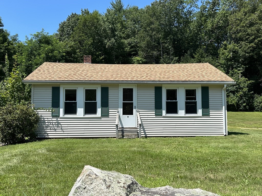 9 West Farms Road Northampton, MA 01062 - Photo 1 of 31 a front view of a house with a garden