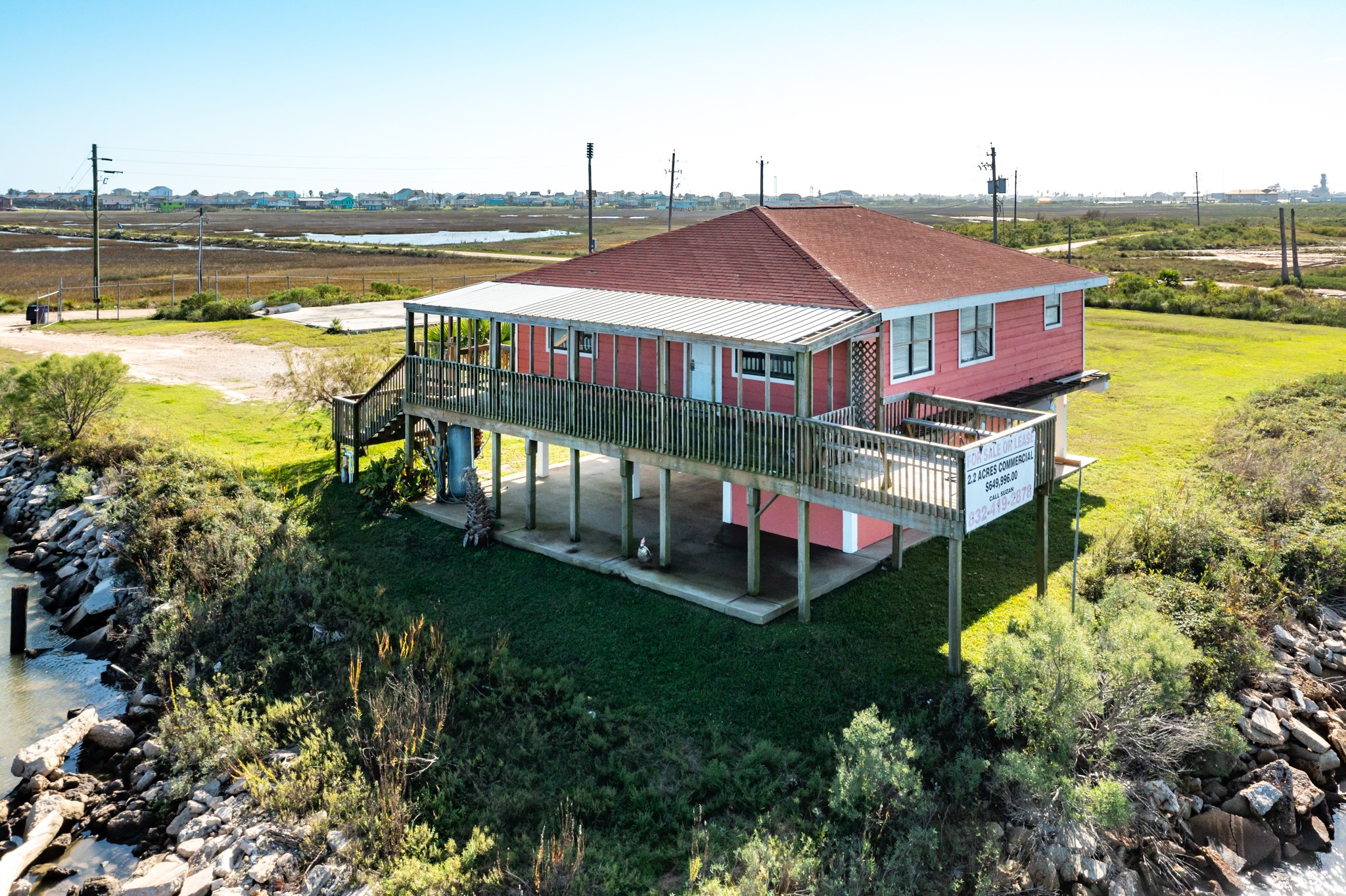 606 Canal Drive Surfside Beach, TX 77541 - Photo 2 of 6 an aerial view of residential houses with outdoor space and swimming pool
