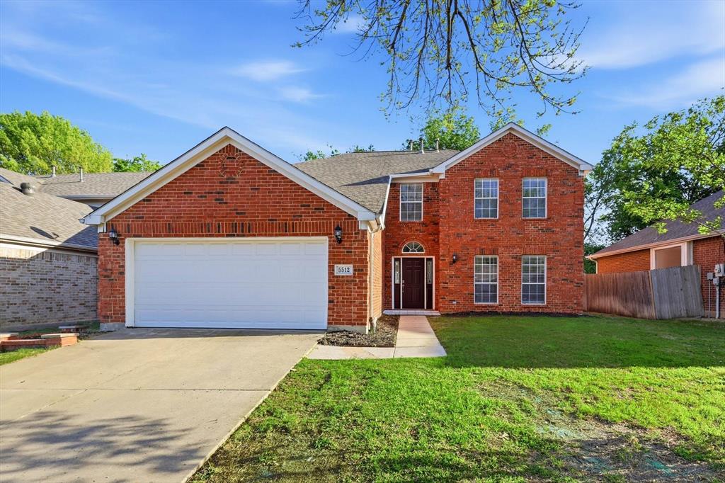 5512 Rocky Mountain Road Fort Worth, TX 76137 - Photo 1 of 33 a front view of a house with a yard