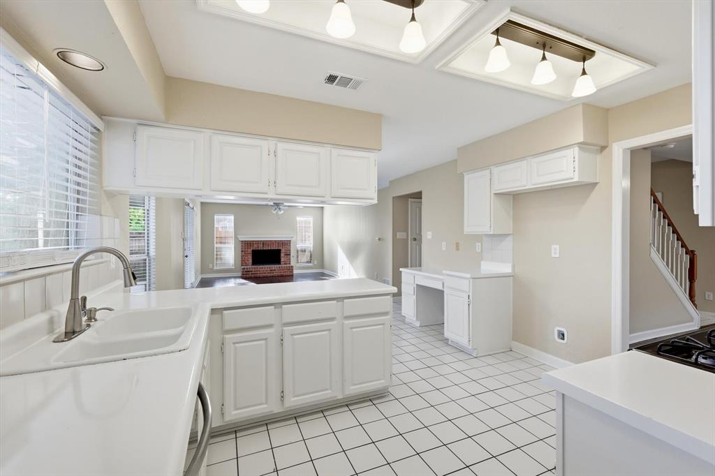 5512 Rocky Mountain Road Fort Worth, TX 76137 - Photo 13 of 33 a kitchen with a sink cabinets and window