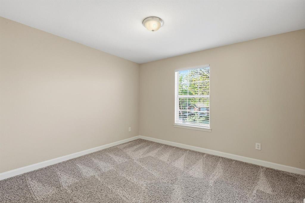 5512 Rocky Mountain Road Fort Worth, TX 76137 - Photo 22 of 33 an empty room with a window