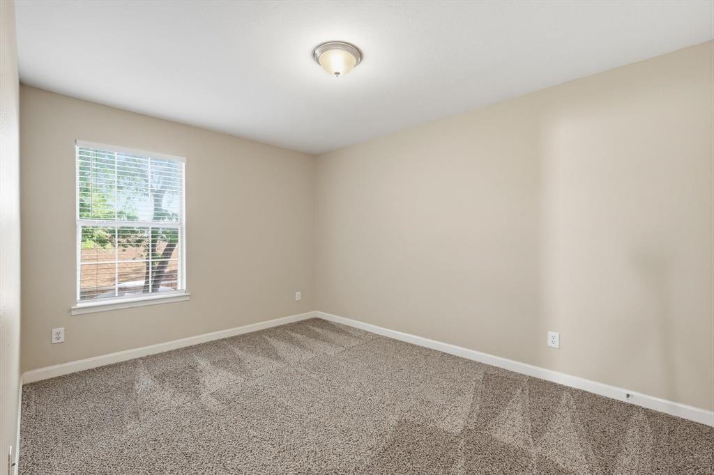 5512 Rocky Mountain Road Fort Worth, TX 76137 - Photo 26 of 33 an empty room with a window