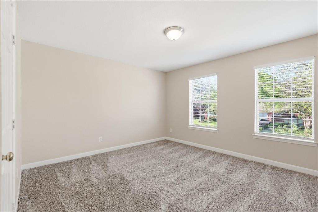 5512 Rocky Mountain Road Fort Worth, TX 76137 - Photo 28 of 33 an empty room with windows