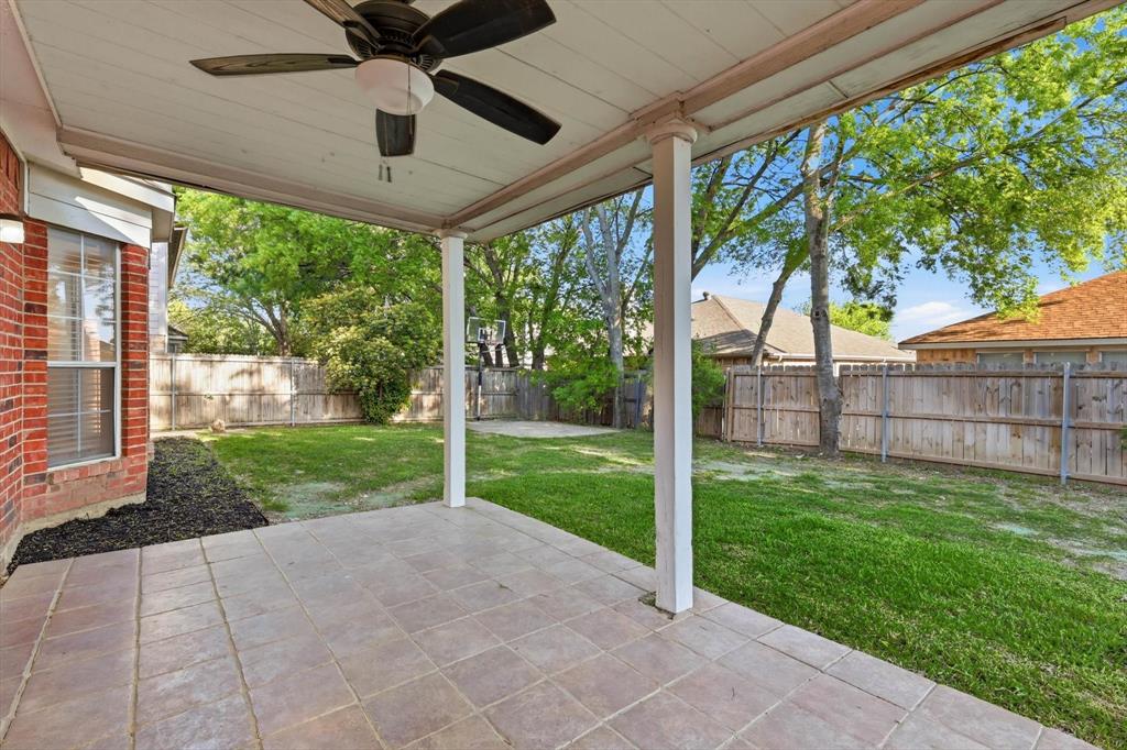 5512 Rocky Mountain Road Fort Worth, TX 76137 - Photo 29 of 33 a view of a porch with a backyard