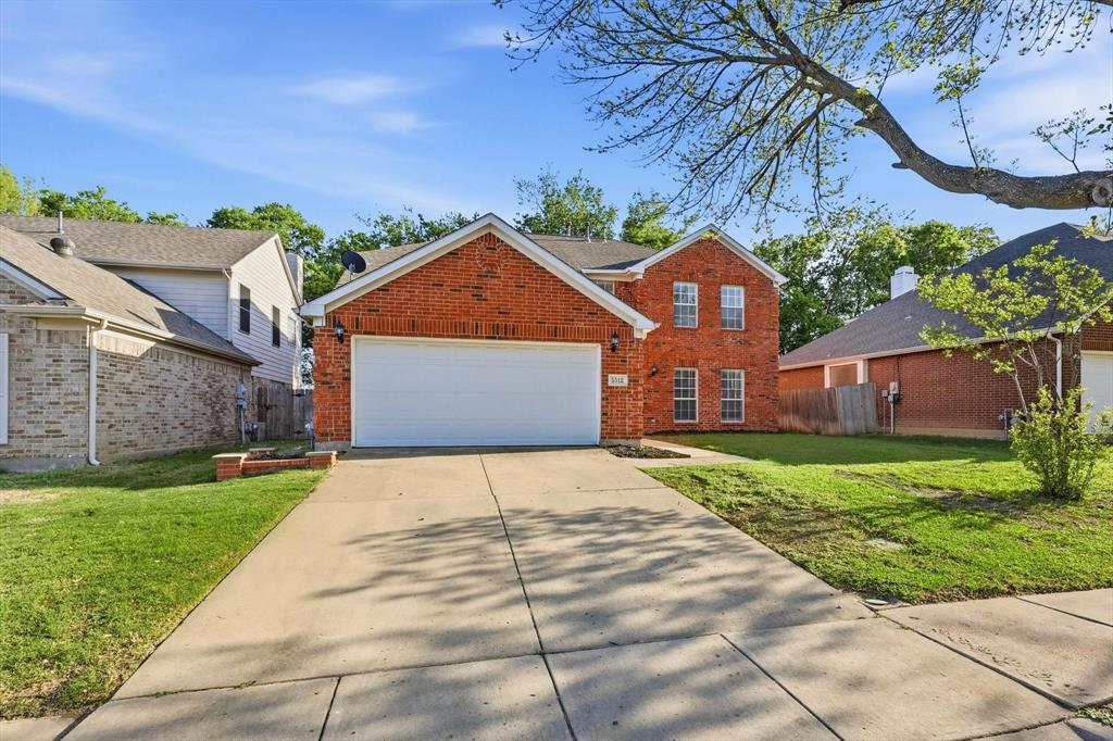 5512 Rocky Mountain Road Fort Worth, TX 76137 - Photo 3 of 33 a front view of a house with a yard