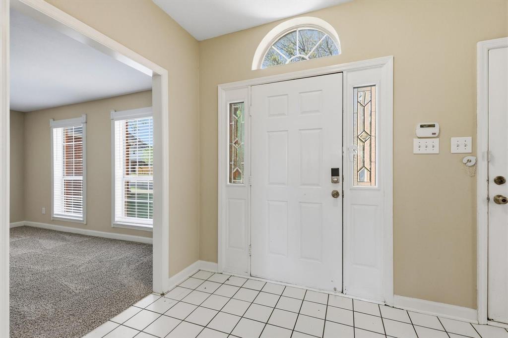 5512 Rocky Mountain Road Fort Worth, TX 76137 - Photo 5 of 33 a view of an entryway with wooden floor