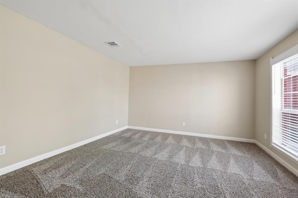 5512 Rocky Mountain Road Fort Worth, TX 76137 - Photo 6 of 33 an empty room with windows