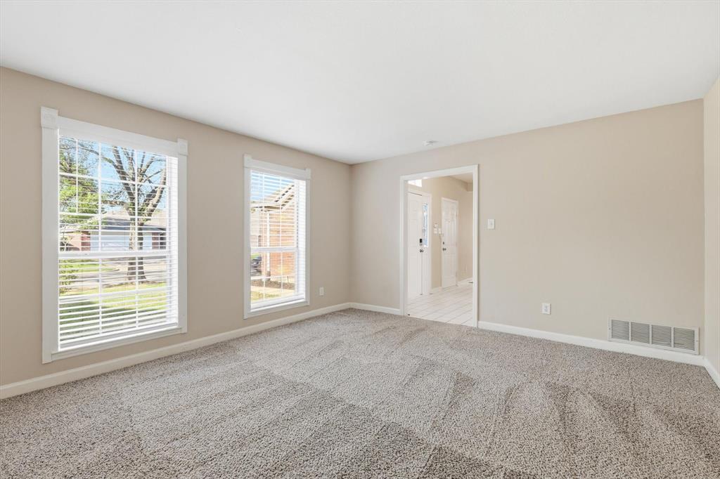 5512 Rocky Mountain Road Fort Worth, TX 76137 - Photo 7 of 33 a view of an empty room with a window