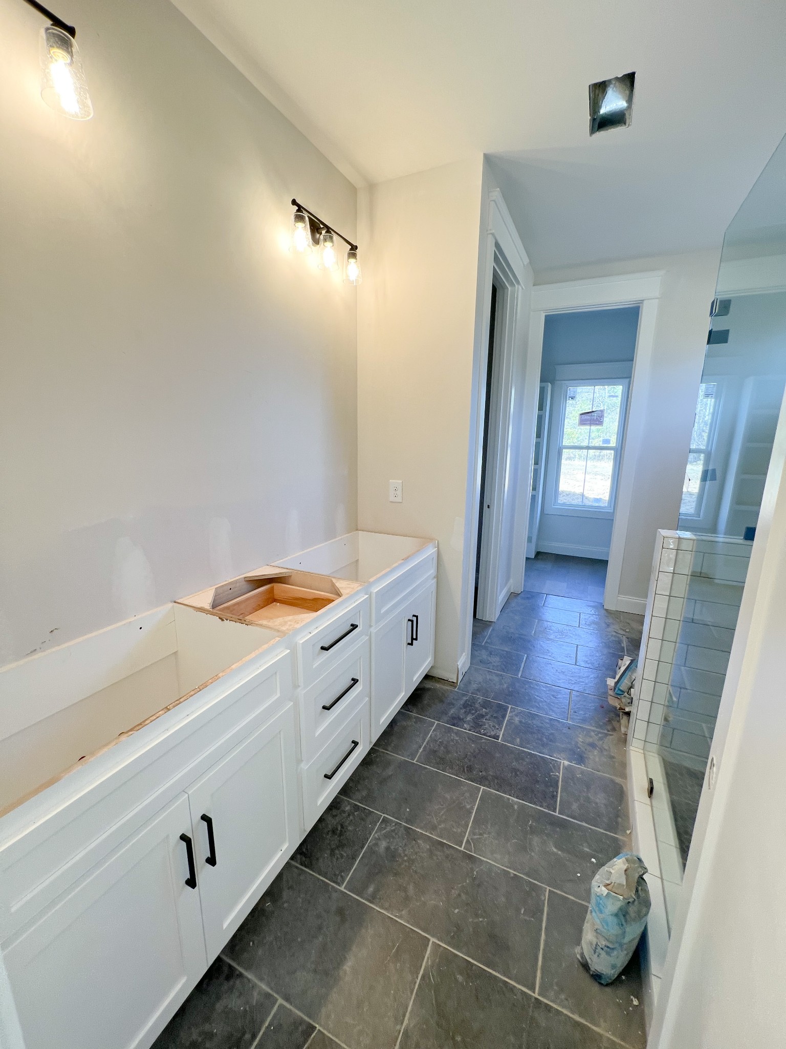 6693 Simmons Bluff Road Lebanon, TN 37090 - Photo 14 of 14 a bathroom with a tub sink and mirror