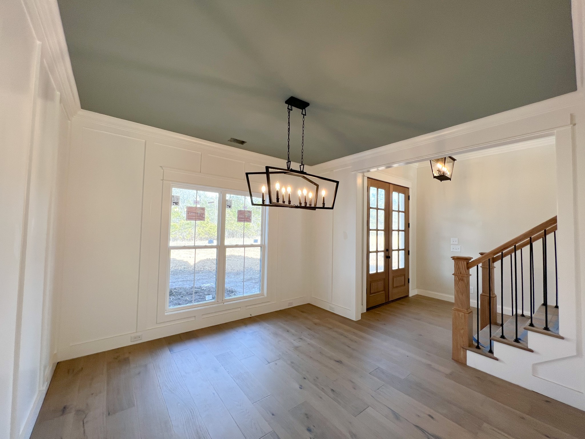 6693 Simmons Bluff Road Lebanon, TN 37090 - Photo 10 of 14 a view of a room with wooden floor ceiling fan and windows