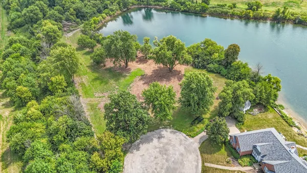 a view of a green field with an ocean