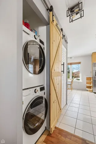 a view of a hallway with washer and dryer