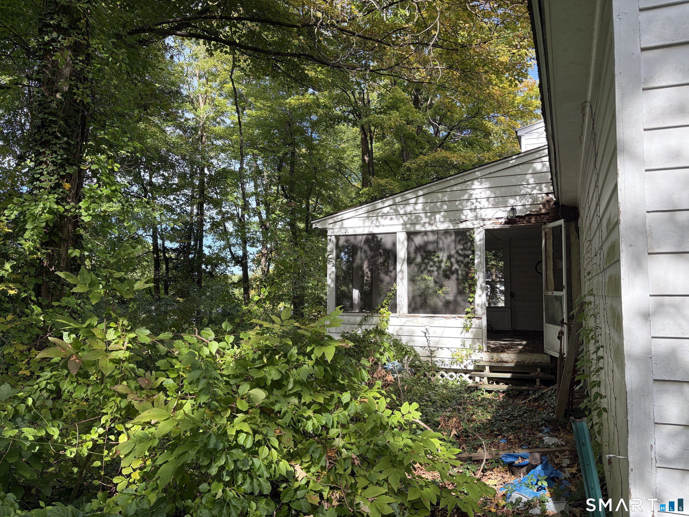 The spacious porch overlooks the yard.