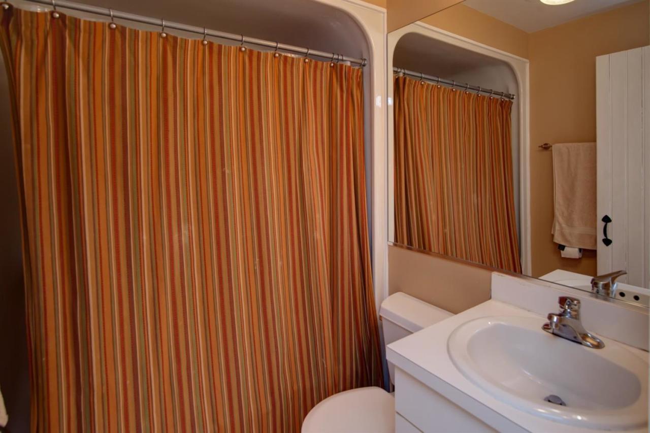9 Hammock Pond Road Mashpee, MA 02649 - Photo 11 of 16 a bathroom with a sink and a mirror
