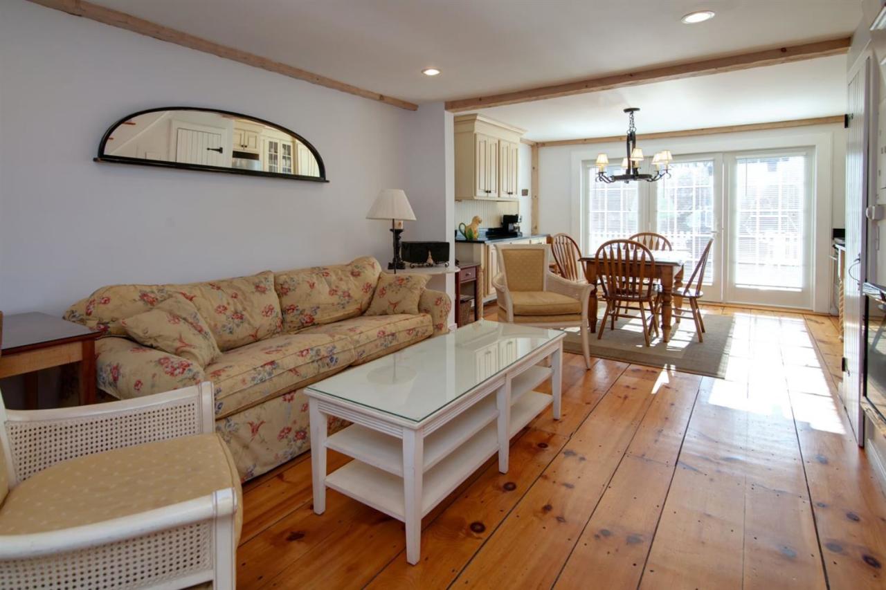 9 Hammock Pond Road Mashpee, MA 02649 - Photo 4 of 16 a living room with furniture a rug and a window