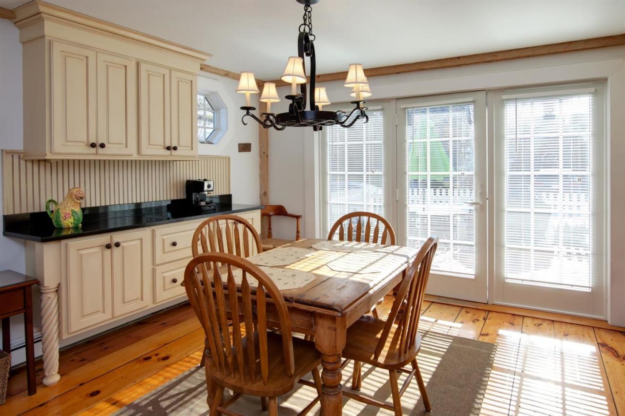 9 Hammock Pond Road Mashpee, MA 02649 - Photo 9 of 16 a view of a dining room with furniture window and wooden floor