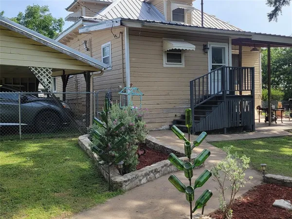 a backyard of a house with seating space