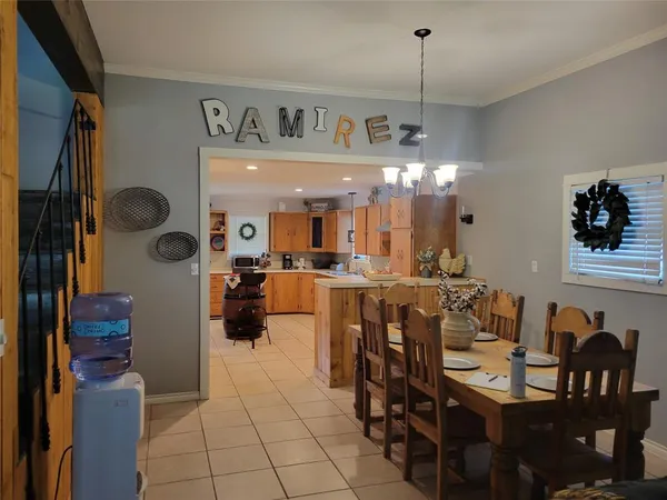 a large kitchen with a table and chairs