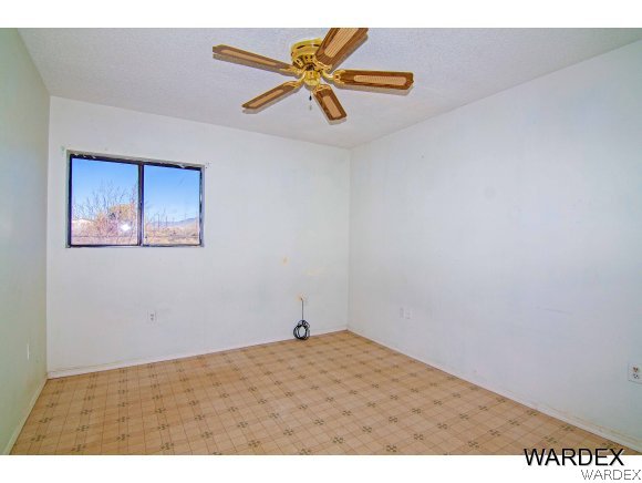 303 South Hano Road Golden Valley, AZ 86413 - Photo 18 of 30 a view of empty room with wooden floor